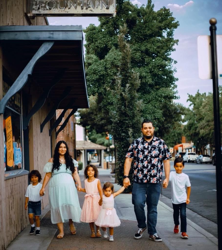 Blaine McKenzie with his family outdoors
